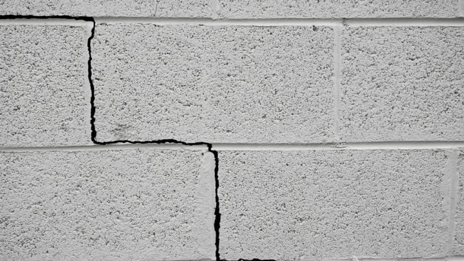 A crack that runs in steps up a block wall